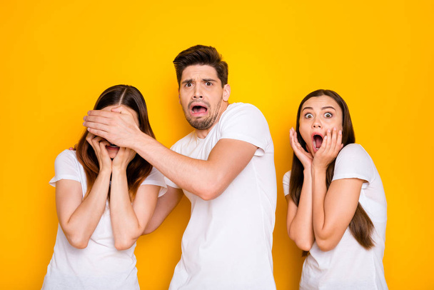 Portrait of three nice attractive lovely nervous devastated frustrated person expressing fear sorrow omg disgust crying isolated over bright vivid shine yellow background - Φωτογραφία, εικόνα