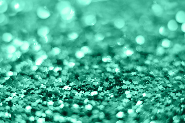 Mint Christmas background from sparkles of stars. blurred - Photo, Image