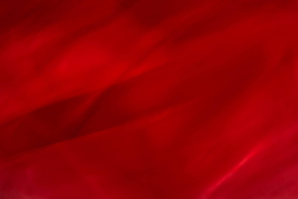Red abstract art background, silk texture and wave lines in moti - Photo, Image