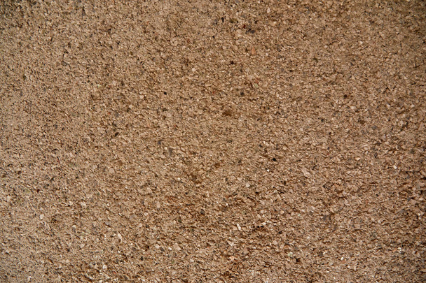 床と壁の質感と背景の小さな茶色の砂の石。テキストまたは画像用のコピースペースを持つデザイン用. - 写真・画像