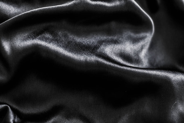 Luxury black soft silk flatlay background texture, holiday glamo - Фото, изображение
