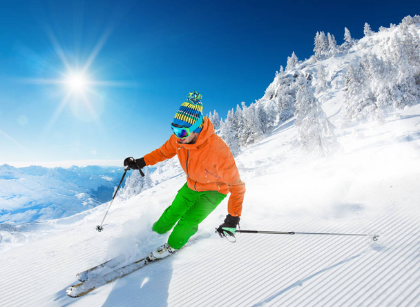 Skier skiing downhill in high mountains - Foto, imagen