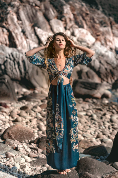 beautiful young woman in stylish boho dress posing outdoors  - Fotografie, Obrázek
