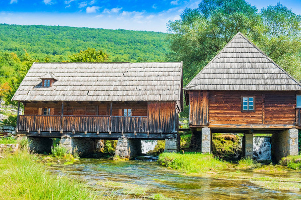 Croatia, countryside region of Lika, Majerovo vrilo river source of Gacka, traditional village with old wooden mills and cottages - Photo, Image