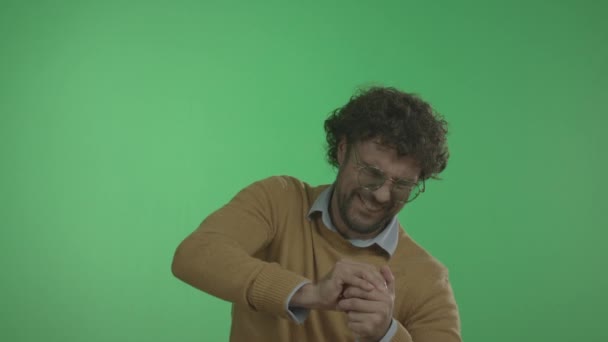 Casual Man Squeezes Juice From Apple with His Hands. - Materiał filmowy, wideo