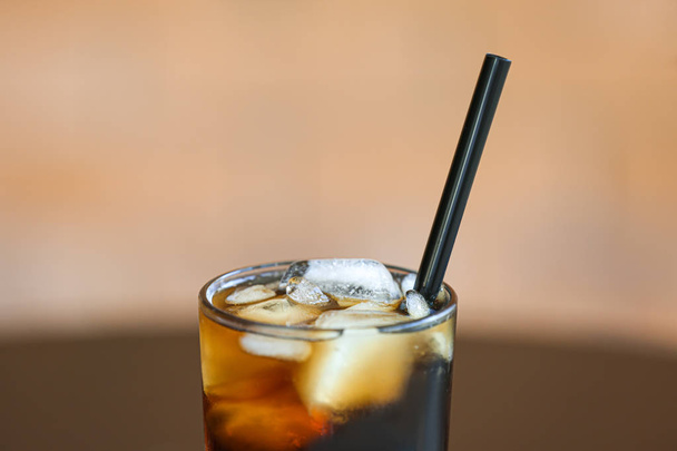 Glass of cold cola on blurred background, closeup - Фото, зображення