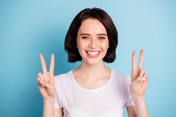 Close-up portrait of her she nice attractive lovely cheerful cheery feminine girl showing double v-sign enjoying leisure isolated on bright vivid shine vibrant blue turquoise color background - Photo, image