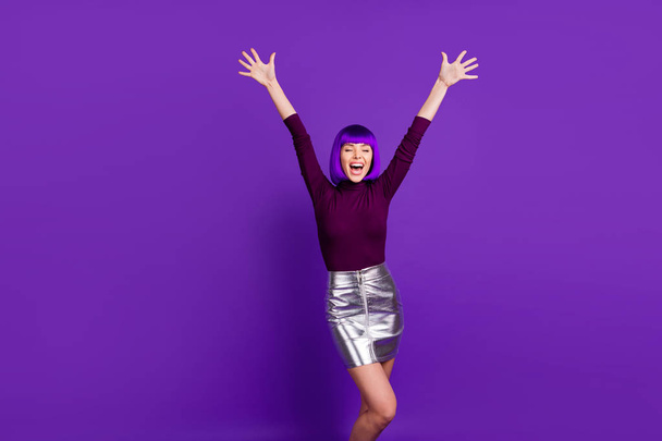 Portrait of cheerful lady raising her palm screaming wearing turtleneck isolated over purple violet background - Foto, Imagen