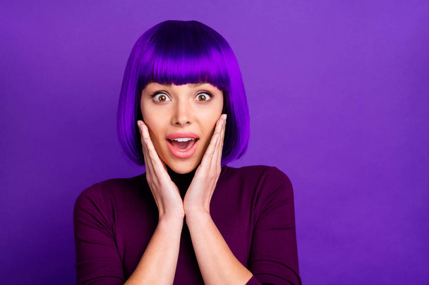 Close up photo of impressed youth touching her cheeks wearing turtleneck isolated over purple violet background - Photo, image