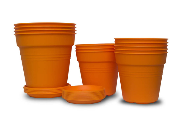 Potes de flor laranja brilhante feitos de plástico
 - Foto, Imagem