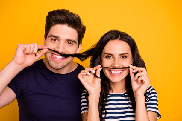 Photo of two fooling funky funny nice cute charming husband and wife pretending to have mustaches with girlfriend showing v-sign while isolated with yellow background - Φωτογραφία, εικόνα