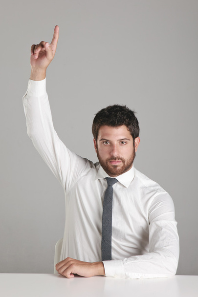 Portrait of a young businessman lifting the hand. - Fotó, kép