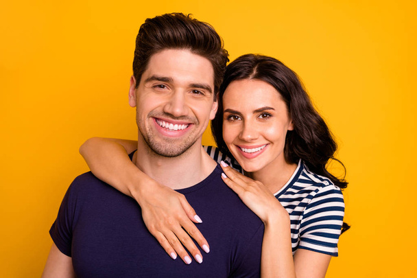 Close up photo of hugging couple toothily smiling beautiful handsome charming fascinating pretty isolated with yellow background - Фото, зображення