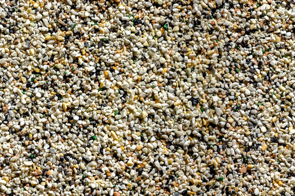 Granite stone crumbs are multi-colored. Seamless texture. Used in construction and architecture. It can be used as a  substrate of an aquarium. - Photo, Image