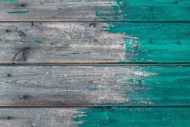 Wooden background texture blue paint partly covering planks. - Foto, Bild