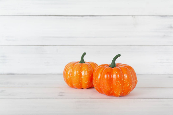 Orange pumpkin on white wood table with copy space. - 写真・画像