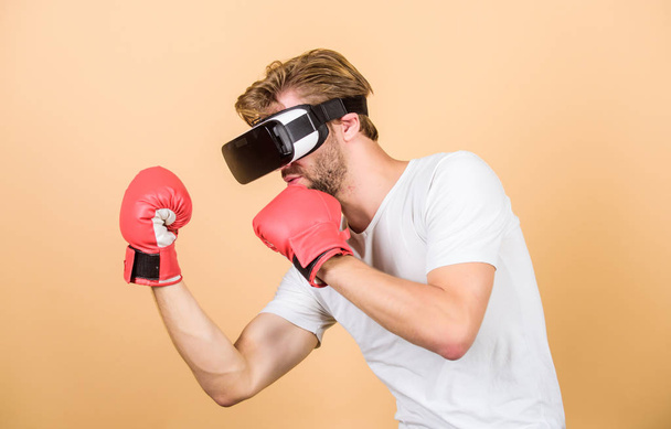 boxing in virtual reality. Digital sport success. man in VR glasses. Futuristic gaming. vr boxing. future innovation. man use new technology. modern gadget. Training boxing game. Great progress - Foto, Imagem