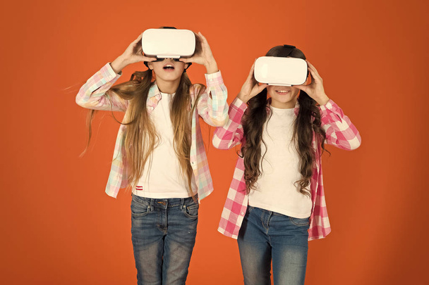Future is present. Cyber space and virtual gaming. Virtual reality technology. Discover virtual reality. Kids girls play virtual reality game. Friends interact in vr. Explore alternative reality - Valokuva, kuva
