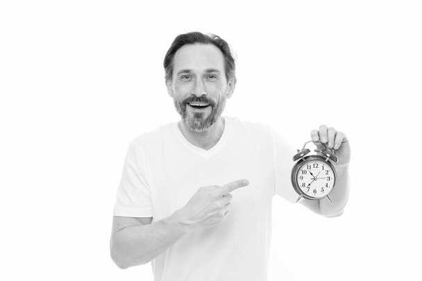 Just on time. Man bearded mature guy hold clock isolated on white. Man with beard check what time is it. Time management skills. Personal schedule and daily regime. Alarm clock morning time - Foto, Imagem