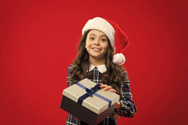 Little girl child in santa red hat. Christmas shopping. New year party. Santa claus kid. Merry Christmas and Happy New Year. Present for Xmas. Childhood. Happy winter holidays. Small girl - Φωτογραφία, εικόνα