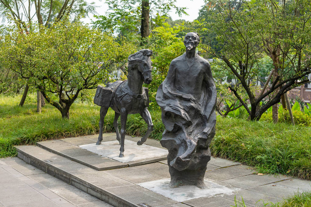 Dufu chinese poet and a horse statues in HuanHuaXi public park - 写真・画像