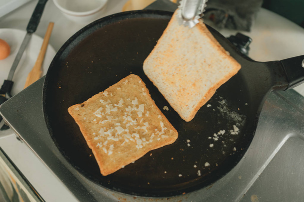 Making recipe of Garlic breads in the kitchen. - Foto, Imagen