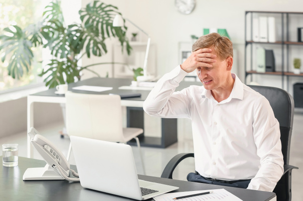 Portrait of stressed businessman in office - Photo, Image