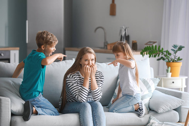 Angry children scolding their mother at home - Photo, Image