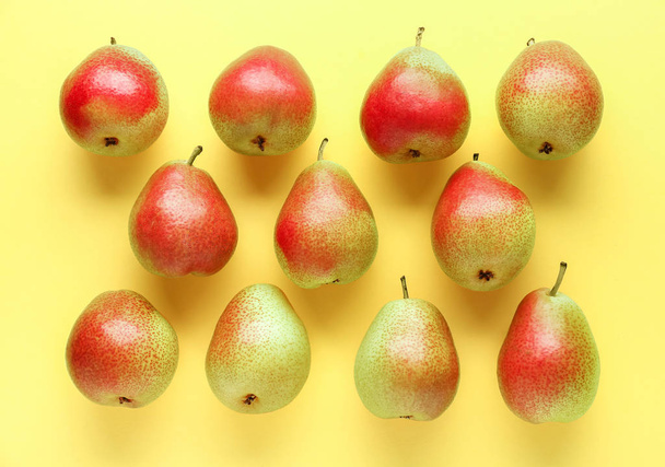 Sweet ripe pears on color background - Zdjęcie, obraz