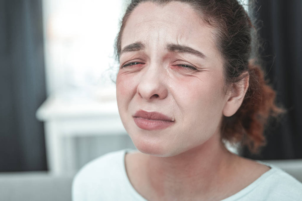 Mature woman with facial wrinkles crying having allergy - Φωτογραφία, εικόνα
