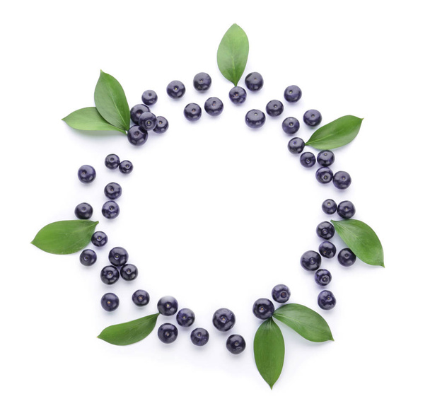 Frame made of fresh acai berries on white background - Photo, Image