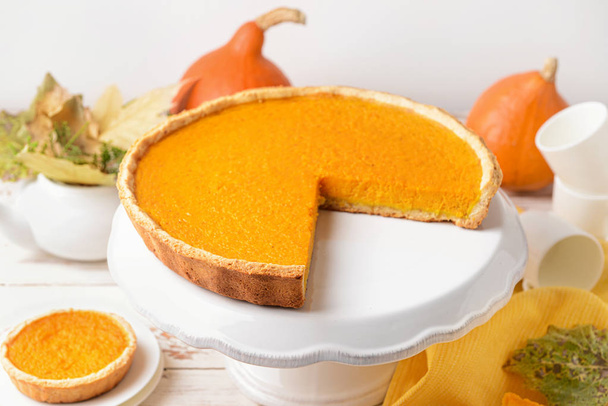 Dessert stand with tasty pumpkin pie on table - 写真・画像