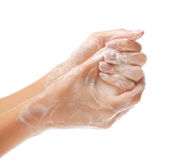 Mãos femininas com espuma de sabão no fundo branco
 - Foto, Imagem