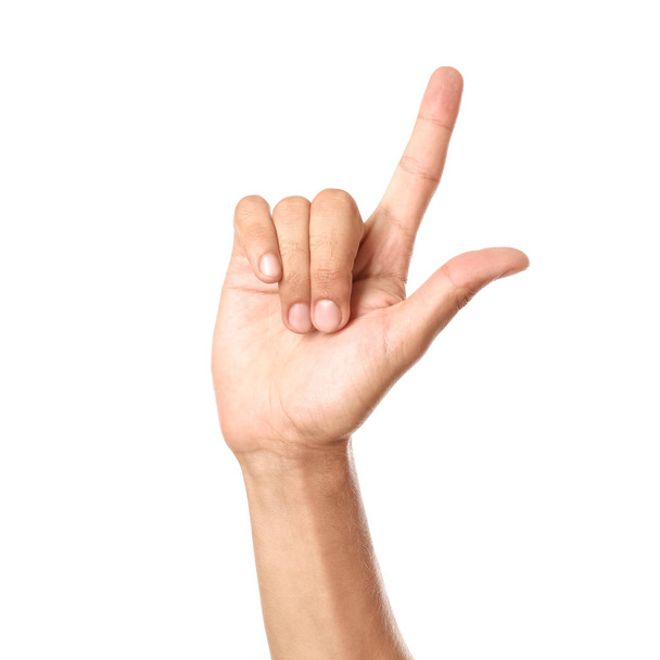 Male hand pointing at something on white background - Foto, imagen