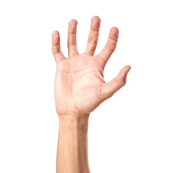 Male hand grabbing something on white background - Фото, зображення