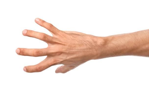 Männliche Hand ergreift etwas auf weißem Hintergrund - Foto, Bild