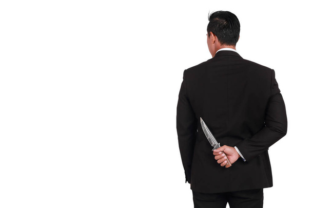 portrait businessman hold knife on the back isolated on white ba - Photo, Image