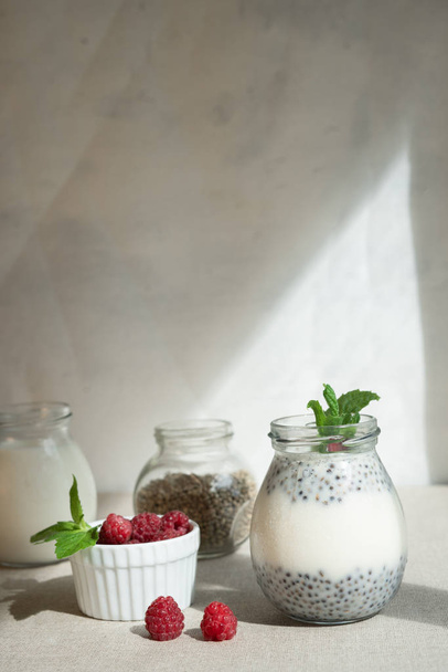 Healthy vanilla hemp pudding in a glass with fresh berries - Foto, immagini