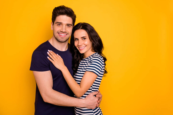 Portrait of his he her she nice attractive lovely charming cute tender gentle cheerful cheery people married spouses embracing spending free time isolated over bright vivid shine yellow background - Photo, Image