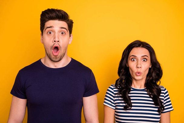 Close-up portrait of his he her she nice attractive lovely funny terrified people married spouses showing stupor expression pout lips isolated over bright vivid shine yellow background - Foto, Imagem