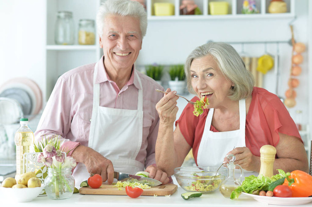 Senior couple cooking together at kitchen   - Foto, imagen