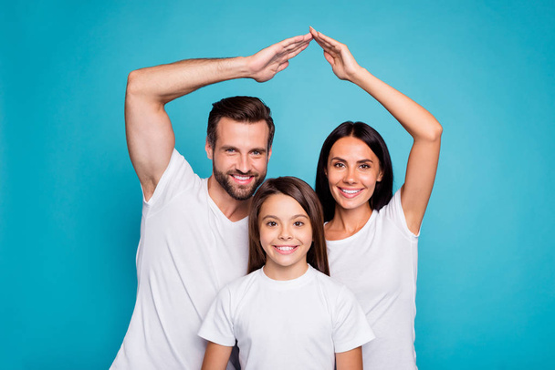 Daddy mommy and little lady under protection on arms roof wear casual outfit isolated blue background - Fotó, kép