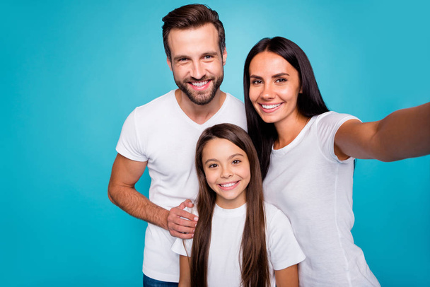 Photo of daddy mommy and small lady making selfies wear casual outfit isolated blue background - Foto, Bild