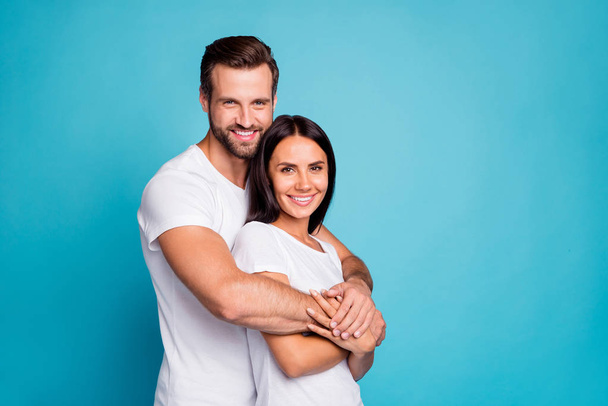 Photo of pair in love standing piggy back together wear casual outfit isolated blue background - Fotó, kép