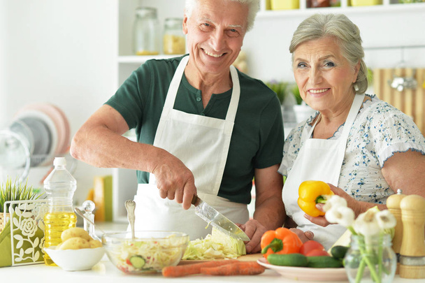 Senior couple cooking together at kitchen   - Foto, Imagem
