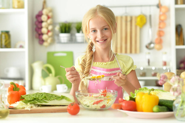 cute girl cooking on kitchen - Fotó, kép
