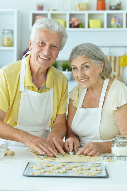senior couple baking  in the kitchen  at home - Fotoğraf, Görsel