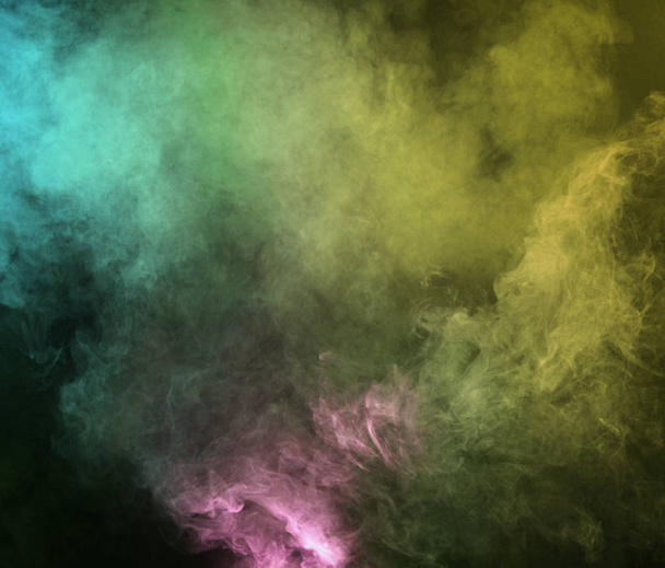 Abstract smoke on a dark background.  Movement of color smoke - Photo, Image