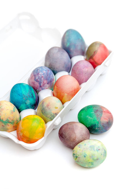 Group of Easter painted eggs in white container - Foto, afbeelding