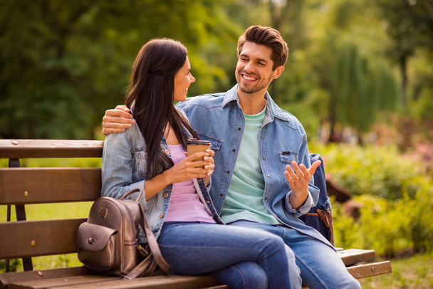 Profile side view of his he her she nice attractive charming cute cheerful cheery communicative friends wearing denim spending free time in green wood forest outdoors springtime - Foto, Bild